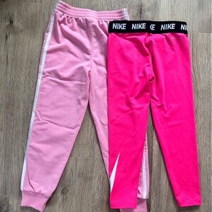 One pair Adidas sweatpants and one pair of Nike Dryfit leggings